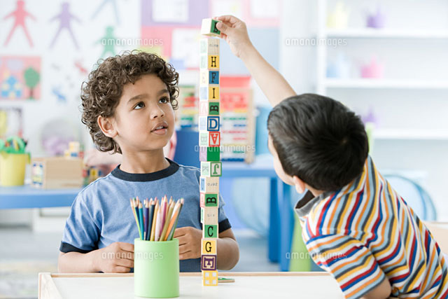 Two boys playing with building blocks
(c)Image Source