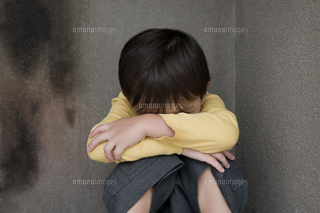 Boy crying in a corner
(c)Image Source