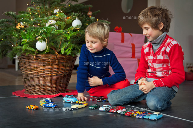 Two boys playing with Christmas presents
(c)Image Source