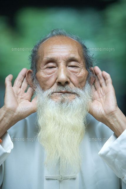 man holding hands behind ears (c)James Hardy/Zen shui - 11025004366