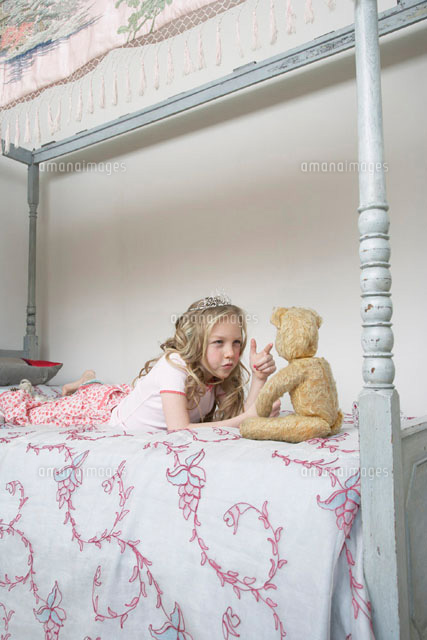 Girl Playing With Teddy Bear
(c)Radius Images