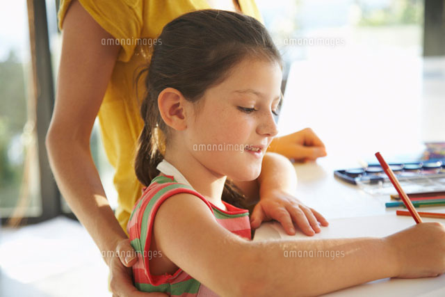 Little Girl Drawing with Mother
(c)Radius Images