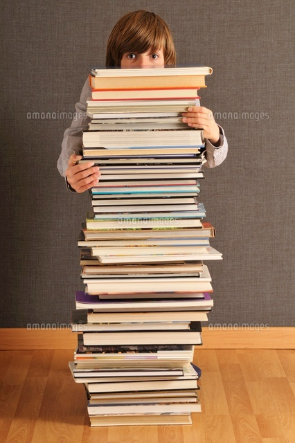 Boy Behind Stack of Books
(c)Radius Images