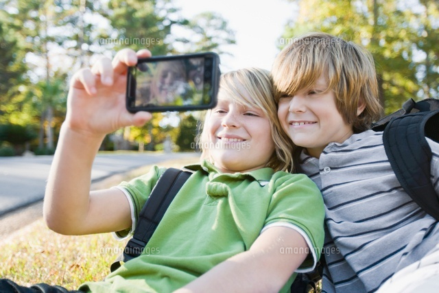 Boys taking Picture with Camera Phone
(c)Radius Images