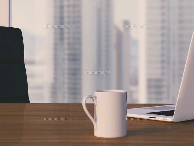 Digital Illustration of Desk with Arm Chair, Laptop and Mug in front of Skyline
(c)Radius Images