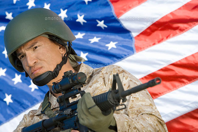 Soldier holding rifle in front of United States flag (por
(c)moodboard