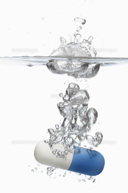 Capsule pill sinking in water close-up
(c)moodboard
