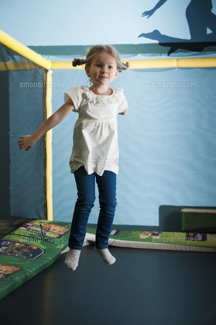 Young girl in mid air on trampoline
(c)moodboard