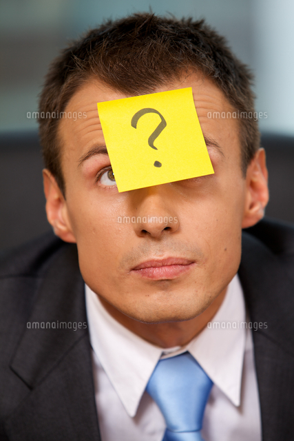 Businessman in office with question mark written on adhesive not
(c)moodboard