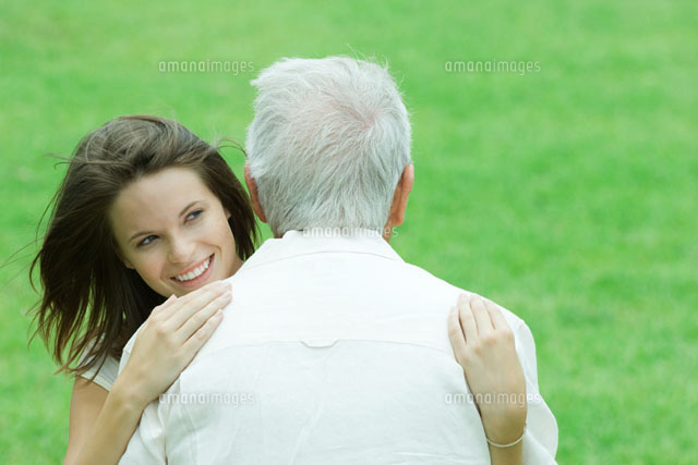 girl hugging her grandfather outdoors
(c)Odilon Dimier/Photo Alto