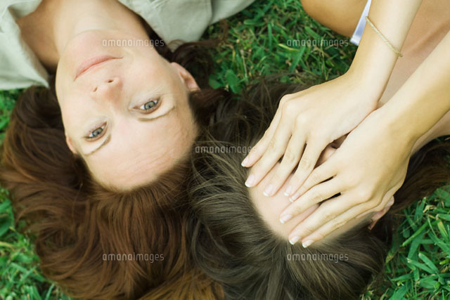 Mother & daughter lying on the ground
(c)Odilon Dimier/Photo Alto