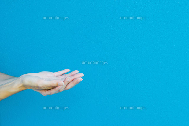 Cupped hands in front of blue wall
(c)Sandro Di Carlo Darsa/Photo Alto