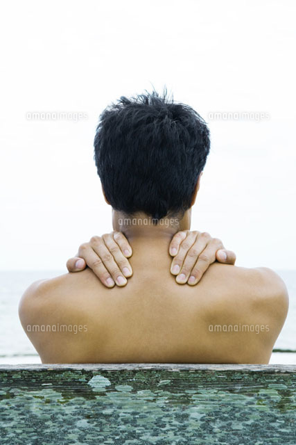 Man with hands on his shoulders
(c)Sandro Di Carlo Darsa/Photo Alto