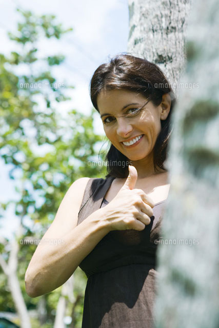 Woman making thumbs up gesture
(c)Sandro Di Carlo Darsa/Photo Alto