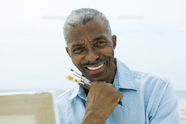 man holding paint brushes outdoors
(c)Eric Audras/Photo Alto