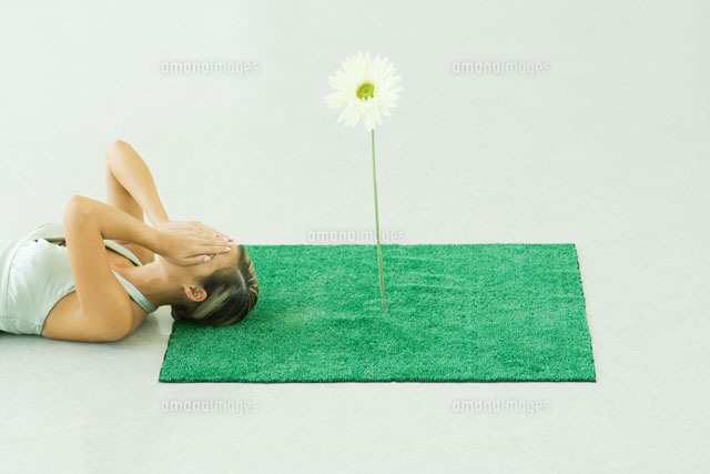 Woman with square of artificial turf
(c)Milena Boniek/Photo Alto