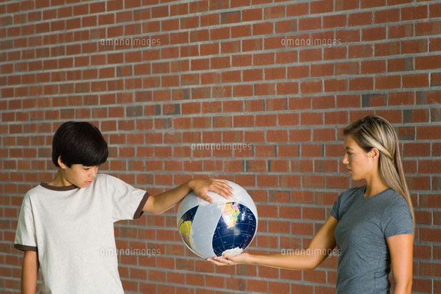 Boy & woman holding bandaged globe
(c)Milena Boniek/Photo Alto
