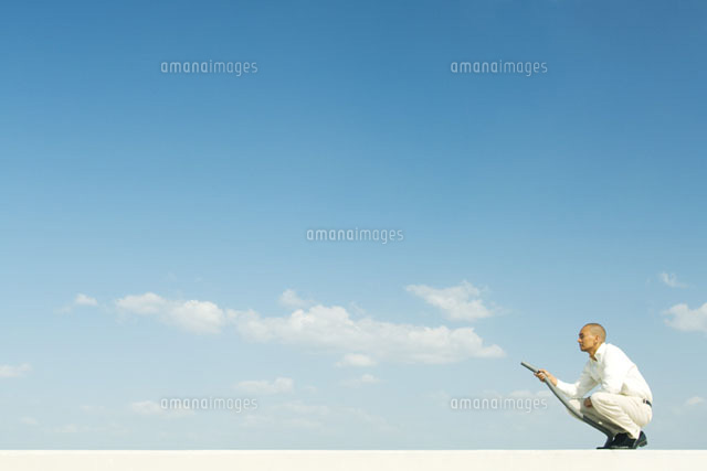 Man vacuuming clouds
(c)Milena Boniek/Photo Alto