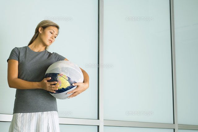 Woman holding bandaged globe
(c)Milena Boniek/Photo Alto