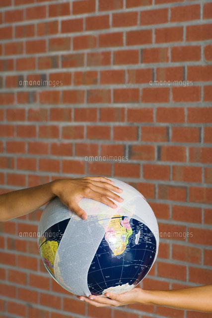 Hands holding a bandaged globe
(c)Milena Boniek/Photo Alto
