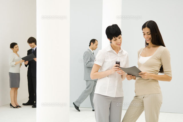 Two businesswomen standing together
(c)Eric Audras/Photo Alto