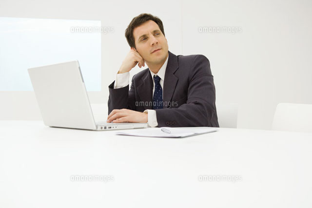 Businessman using laptop computer
(c)Eric Audras/Photo Alto