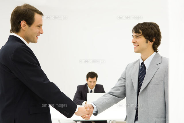 Two male professionals shaking hands
(c)Eric Audras/Photo Alto