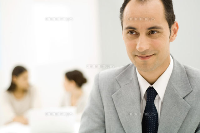 Businessman looking away, smiling
(c)Eric Audras/Photo Alto