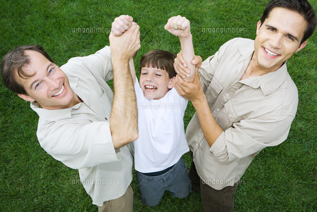 Two men holding up boy by his arms
(c)Laurence Mouton/Photo Alto