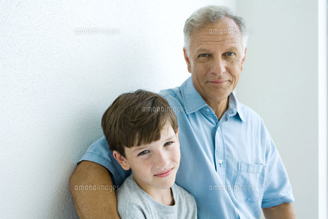 Grandfather & grandson smiling at camera
(c)Laurence Mouton/Photo Alto