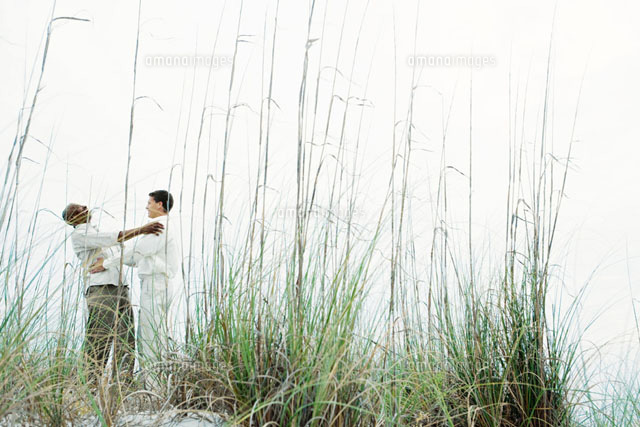 Two men embracing outdoors
(c)Laurence Mouton/Photo Alto