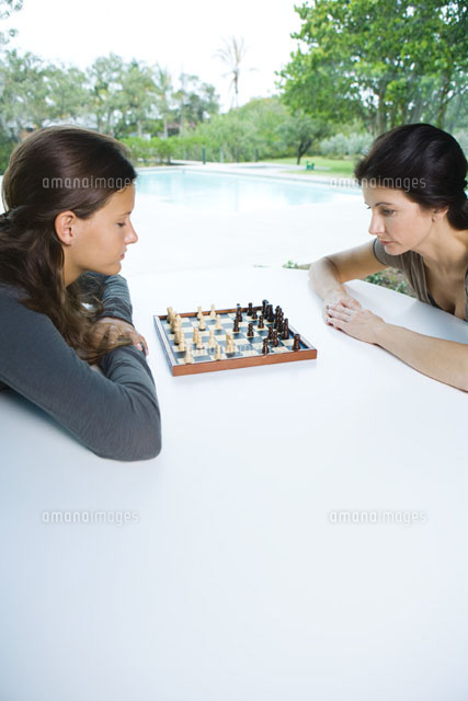 Mother & daughter playing chess together
(c)Laurence Mouton/Photo Alto