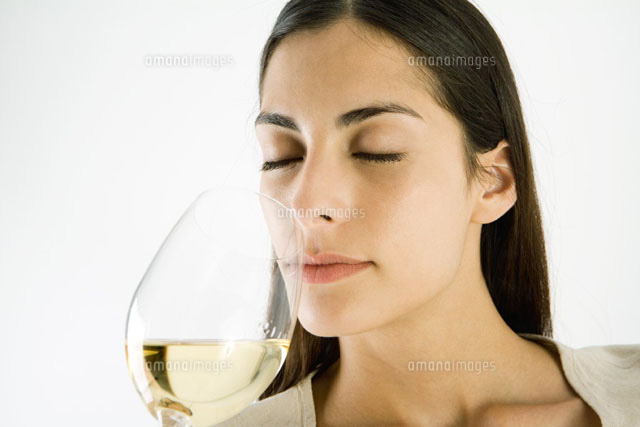 Woman smelling glass of white wine
(c)Laurence Mouton/PhotoAlto
