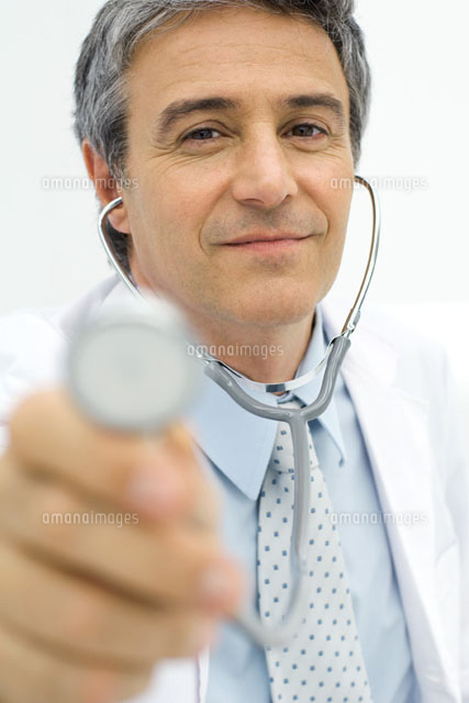 Doctor holding stethoscope toward camera
(c)Odilon Dimier/PhotoAlto