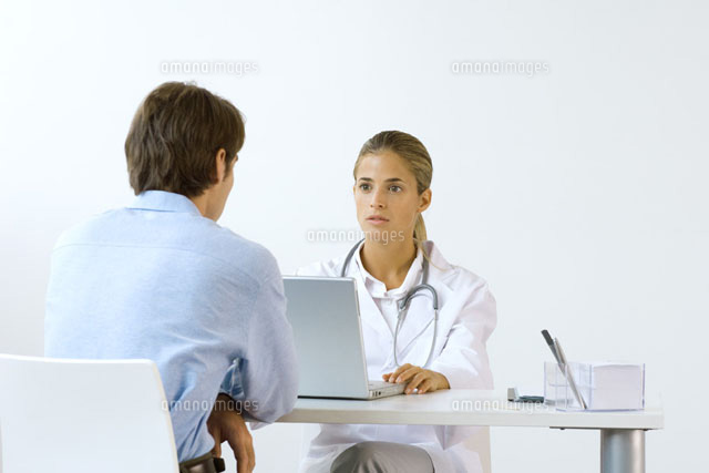Female doctor sitting across from male patient at desk
(c)Odilon Dimier/PhotoAlto