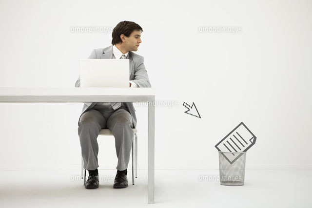 Businessman sitting at desk, looking at computer cursor
(c)Ale Ventura/PhotoAlto