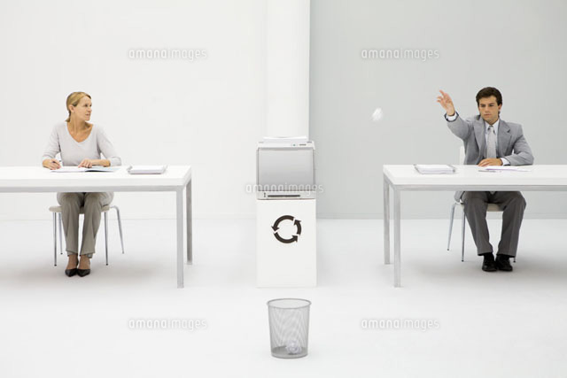 Male office worker throwing paper ball into trash can
(c)Ale Ventura/PhotoAlto