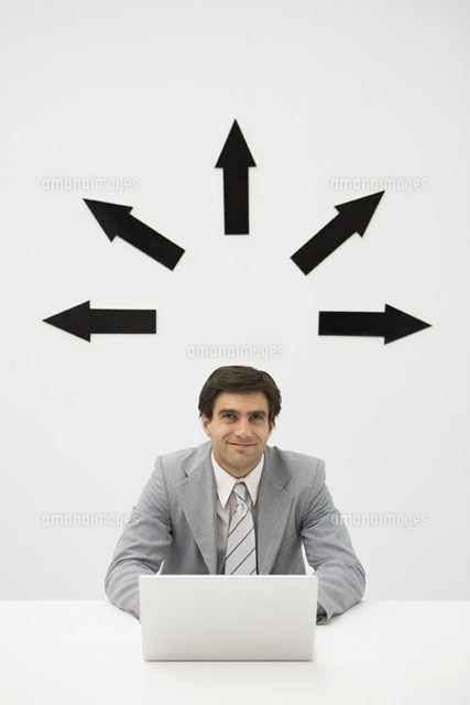 Businessman sitting with laptop, smiling
(c)Ale Ventura/PhotoAlto