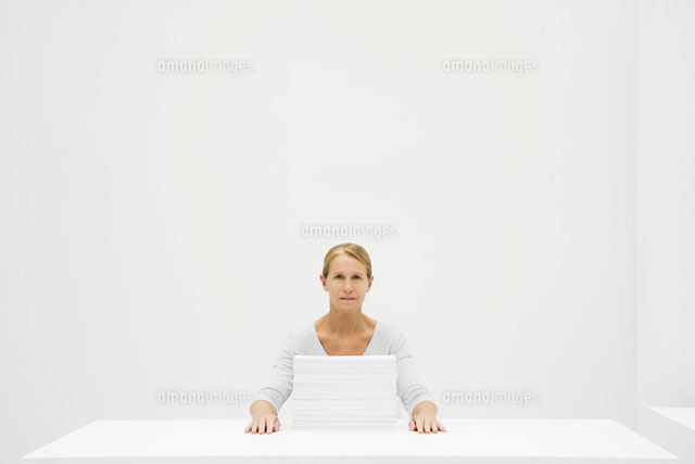 Female office worker sitting behind stack of paper
(c)Ale Ventura/PhotoAlto