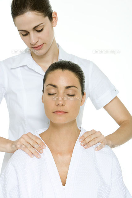 Woman receiving shoulder massage, relaxing with eyes closed
(c)Alix Minde/PhotoAlto