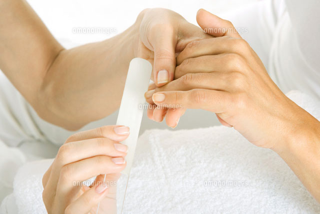 Woman getting her nails filed of hands
(c)Alix Minde/PhotoAlto