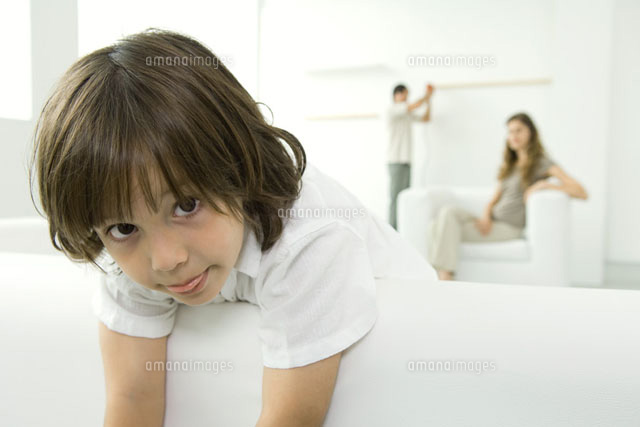 Boy leaning over couch, sticking tongue out at camera
(c)Odilon Dimier/PhotoAlto