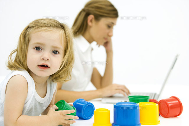 Little girl playing with toys while woman uses computer
(c)Sigrid Olsson/PhotoAlto