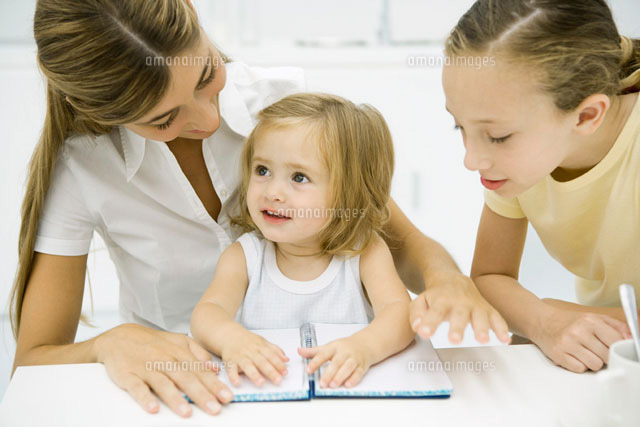 Woman sitting together with two daughters
(c)Sigrid Olsson/PhotoAlto