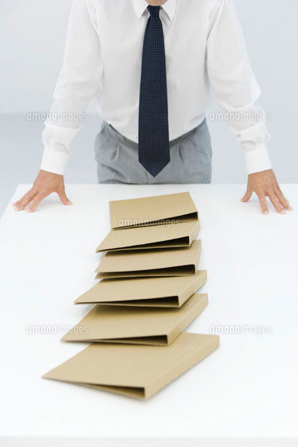 Binders lying on table after a chain reaction
(c)Alix Minde/PhotoAlto