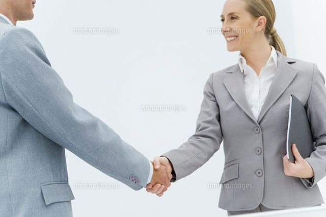 Businesswoman shaking hands with businessman
(c)Alix Minde/PhotoAlto