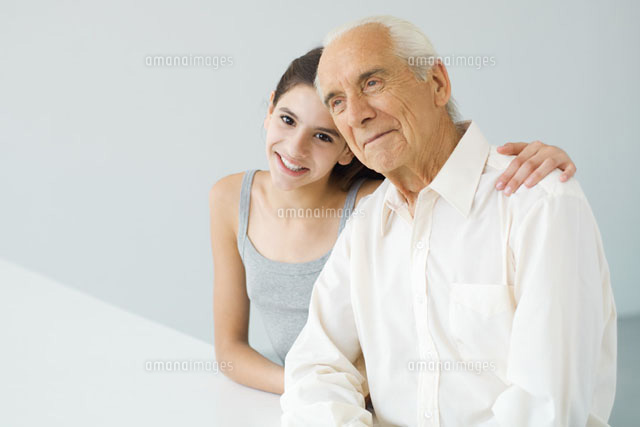 Teenage girl with arm around her grandfather’s shoulder
(c)Eric Audras/PhotoAlto