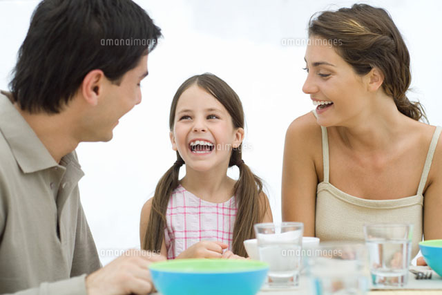 Family looking at each other and laughing
(c)Eric Audras/PhotoAlto