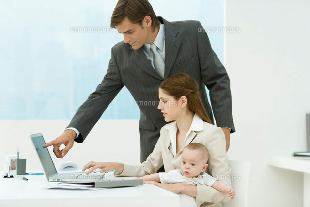 Professional woman in office, holding baby on lap
(c)Alix Minde/PhotoAlto