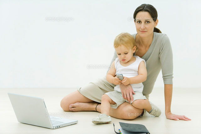 Professional woman sitting on the ground with laptop
(c)Alix Minde/PhotoAlto